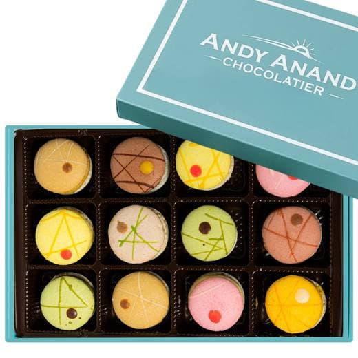 A box of twelve colorful macarons from an independent chocolatier